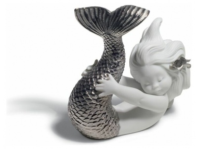 Three Silver Mermaids